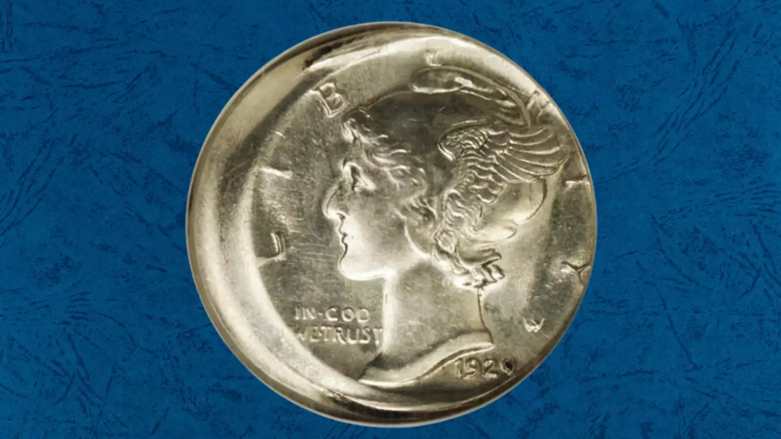 1929-S Mercury dime off-center strike error showing design shifted off-center with blank planchet crescent visible